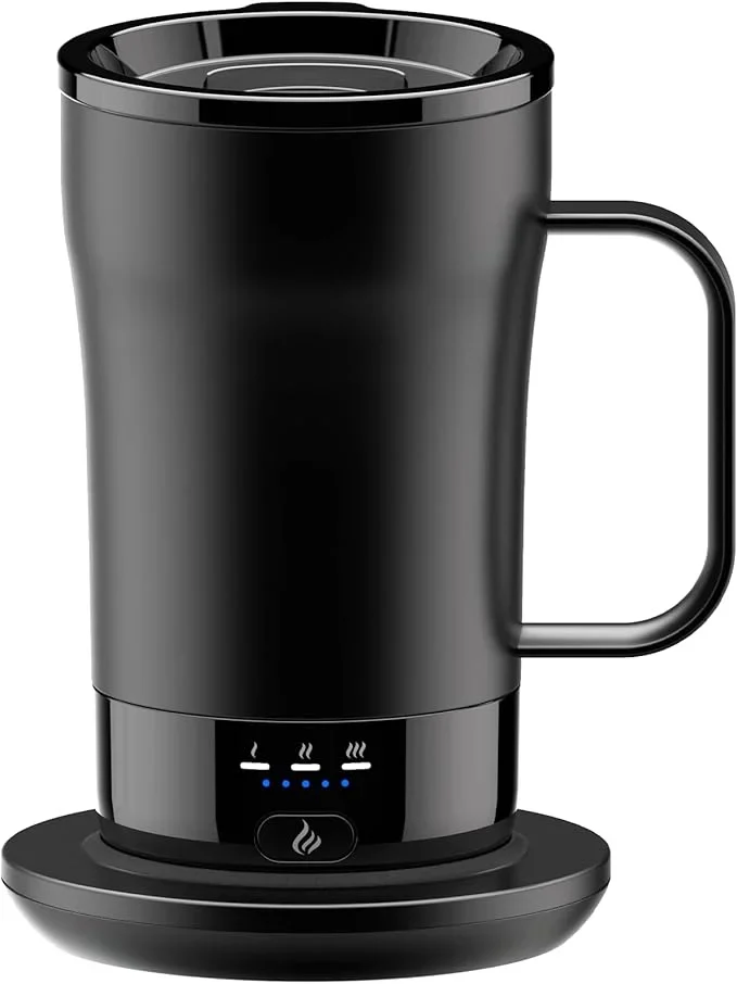 Black temperature controlled mug on a heating pad.