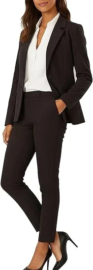 Female wearing a black suit and black heels.