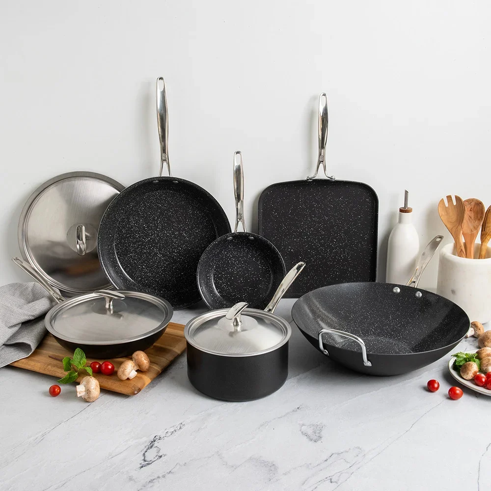 Multiple pieces of premium cookware displayed on a countertop.