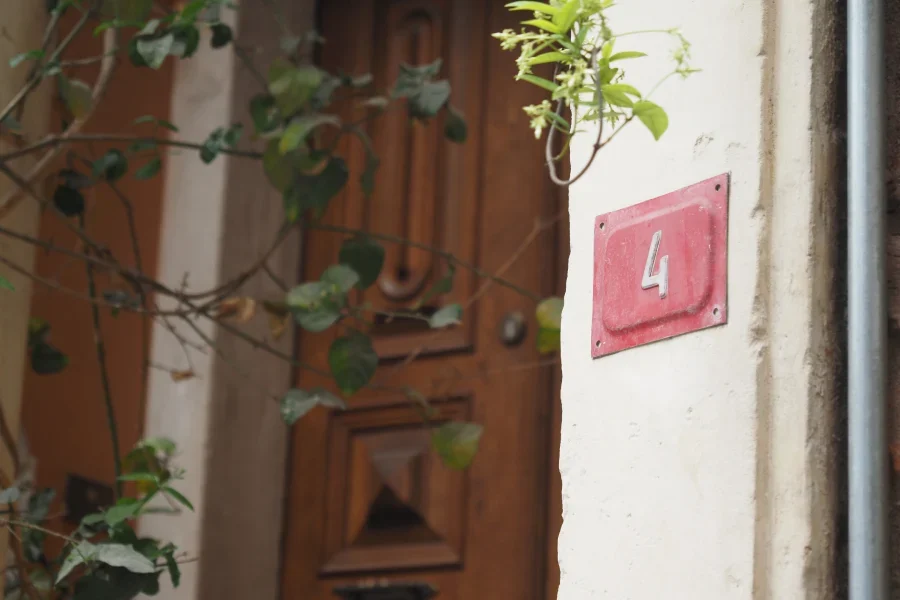 Number Four on Wall near Wooden Doorway.